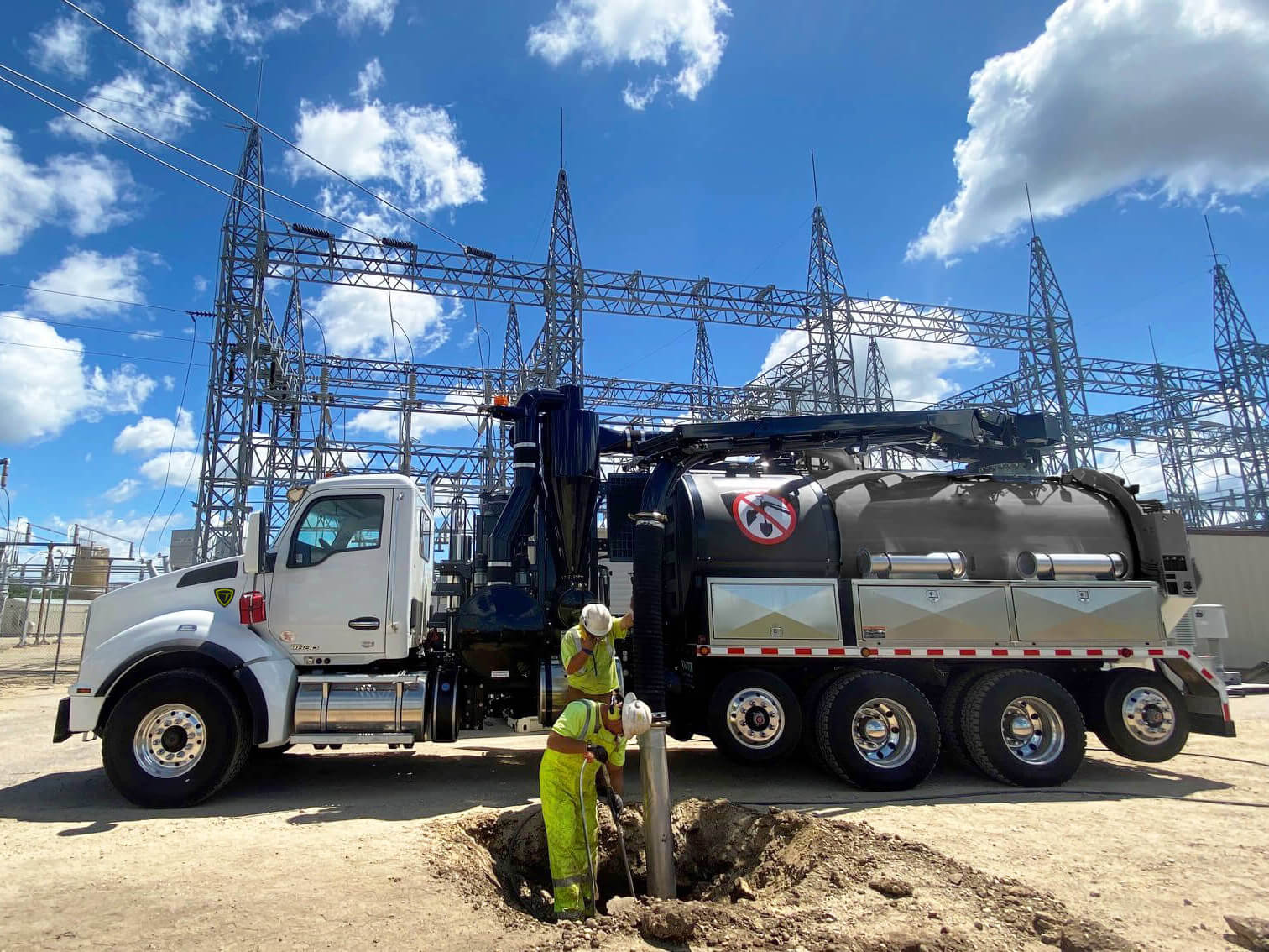TRUVAC HXX full-size vacuum excavator with extended boom on a utility job